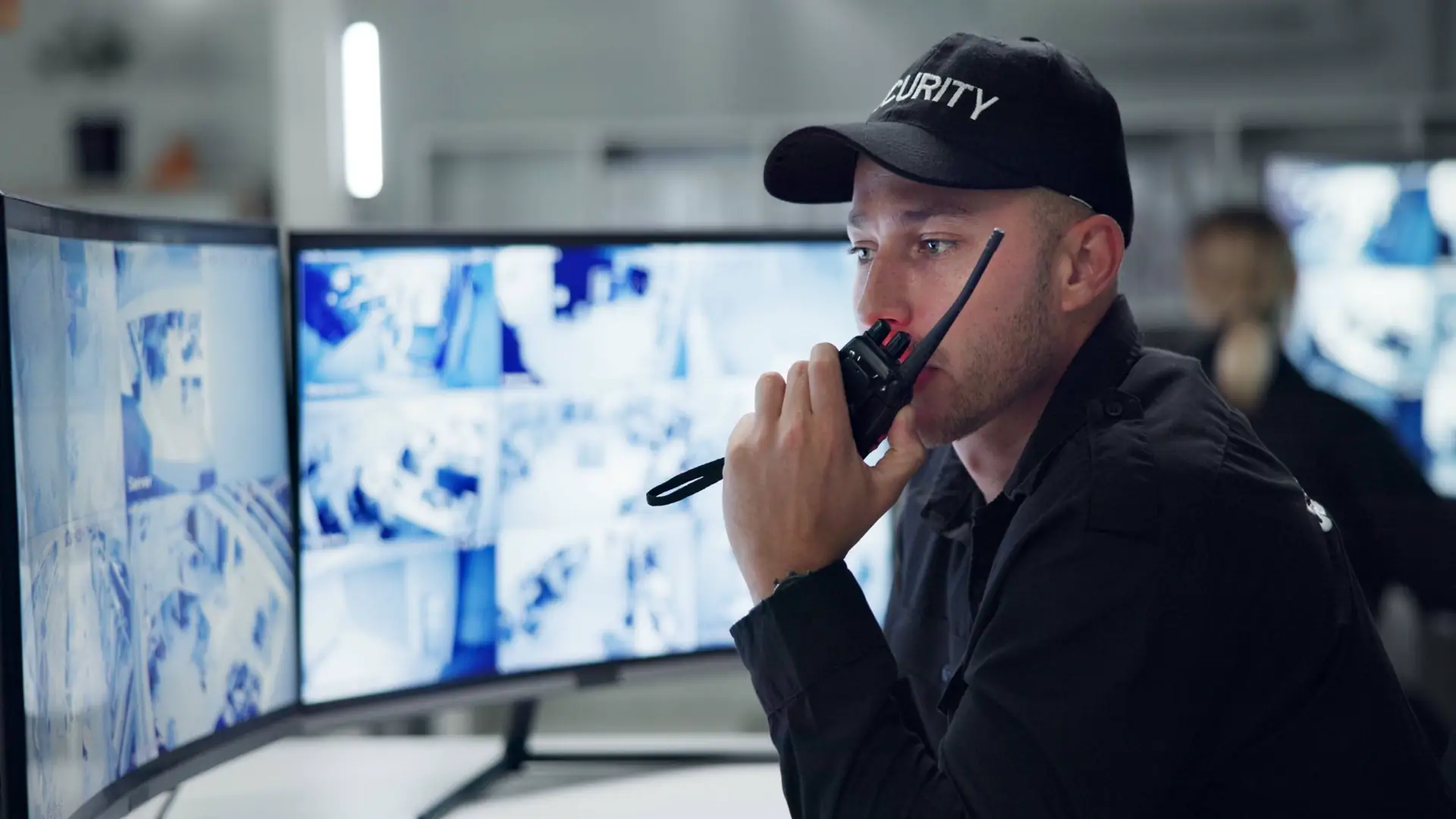 Security guard with walkie-talkie communicating