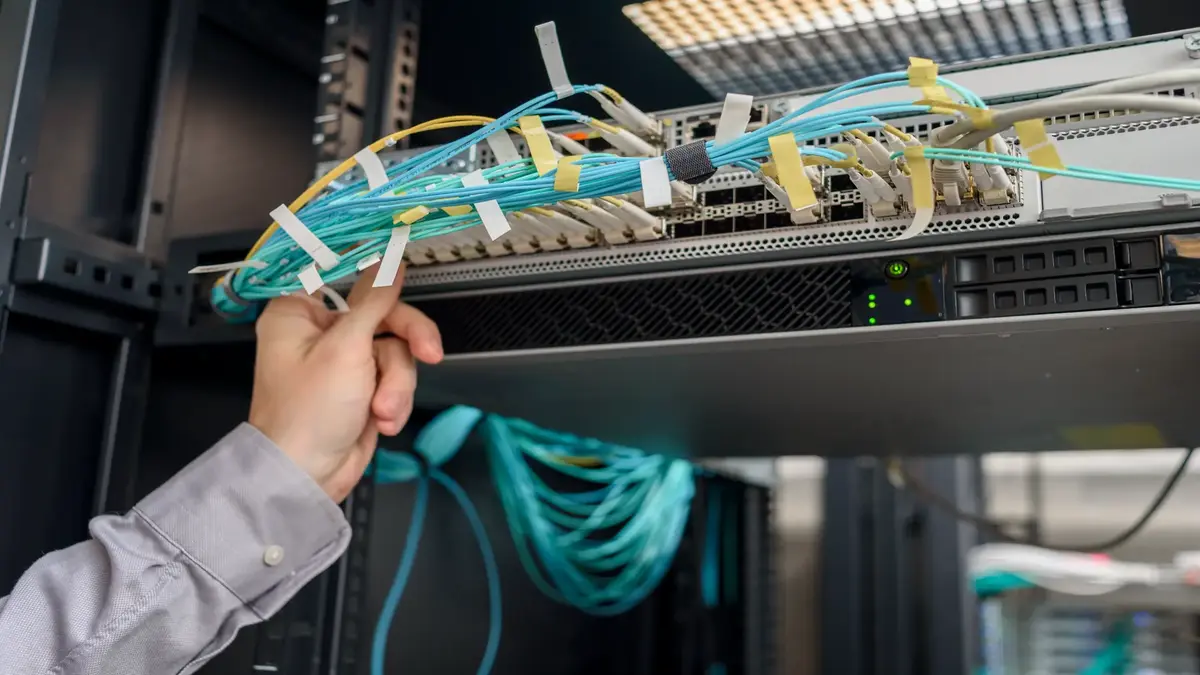 Data center technician performing server maintenance