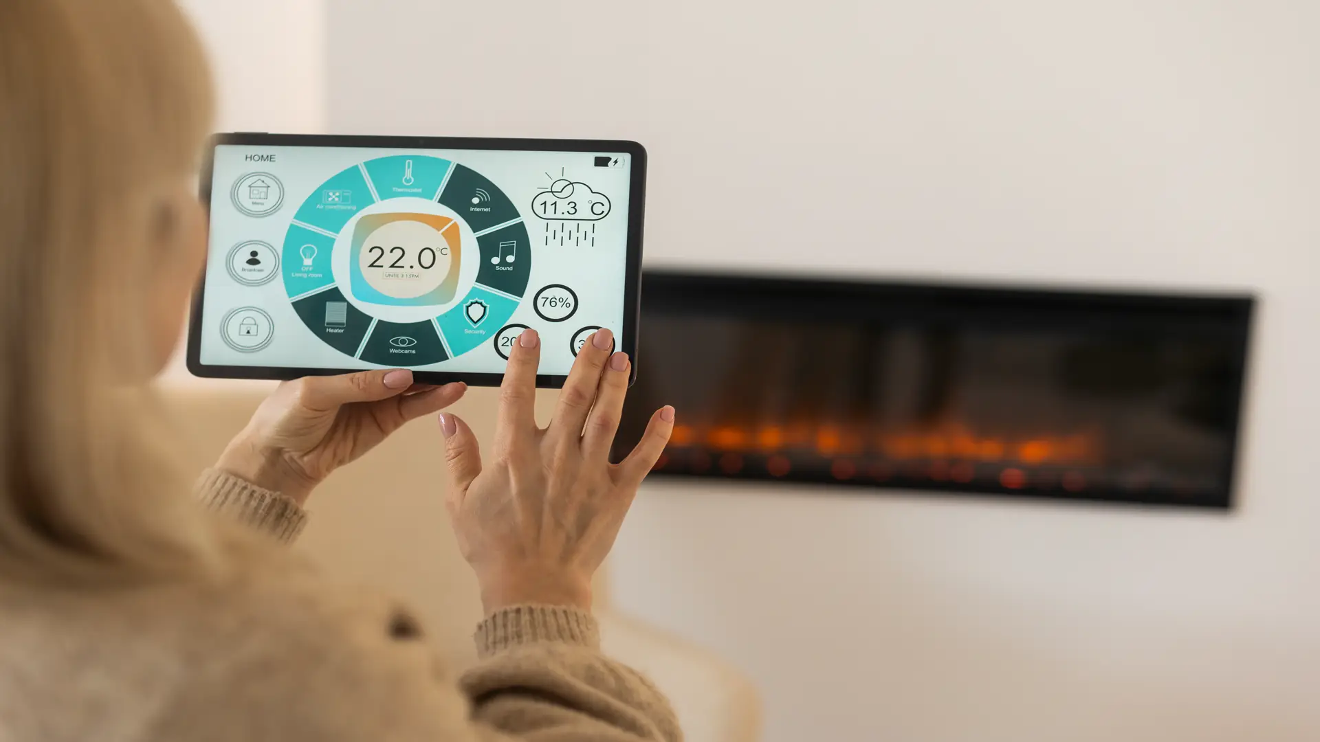 Holding digital tablet in cozy living room