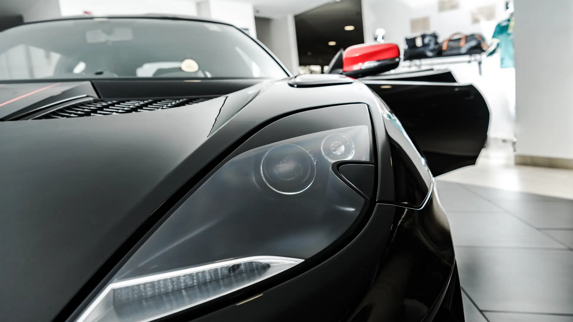 Car keys with modern dealership showroom
