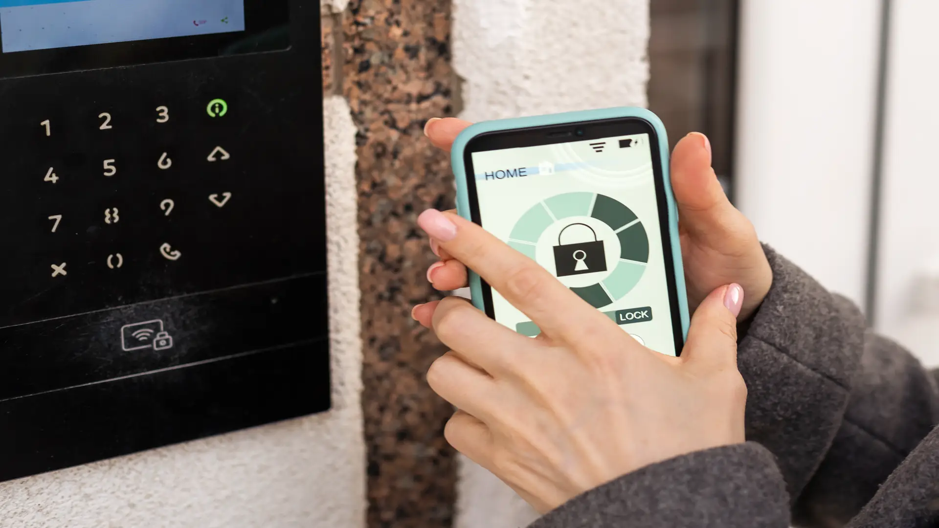 Young woman getting access to building with smart lock