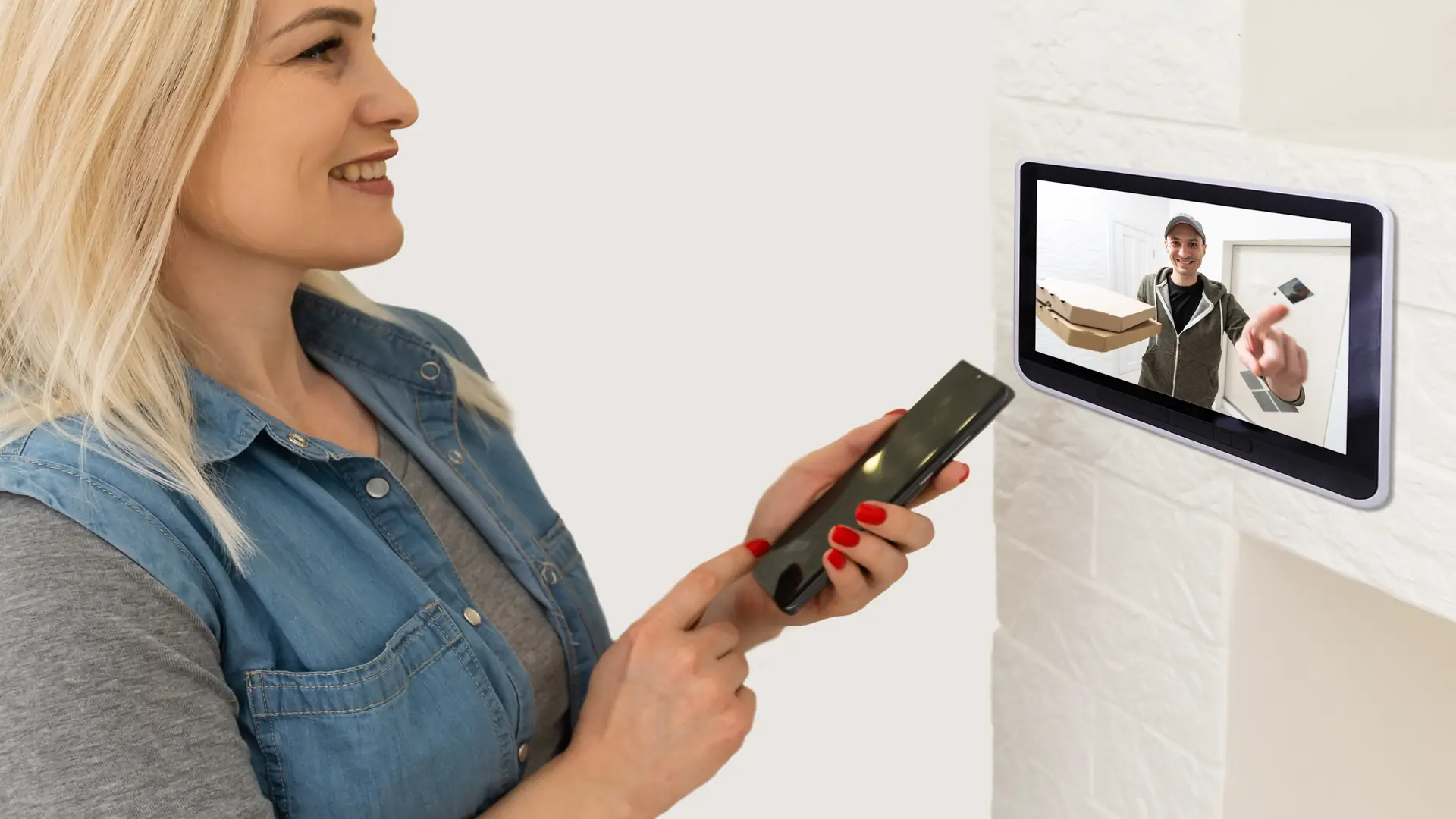 Woman watching delivery man on security camera